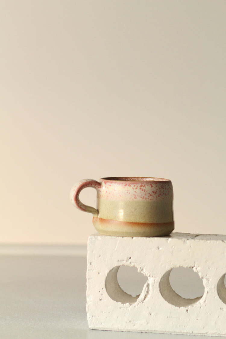 Cream mug with a salted red rim