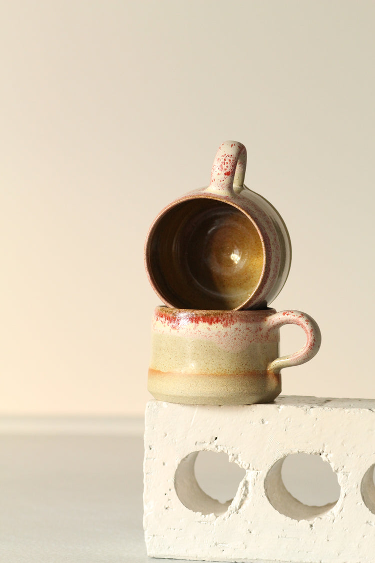 Cream mug with a salted red rim