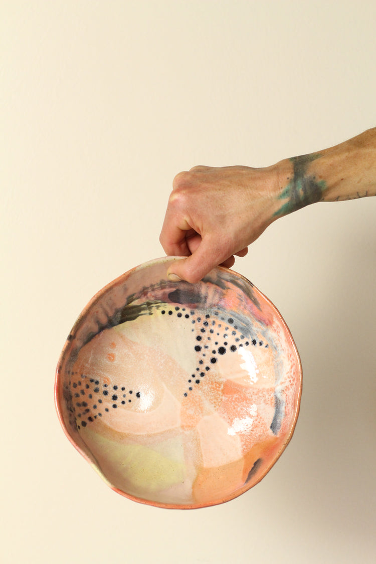 Peach, pink, orange and yellow with black dots everything bowl