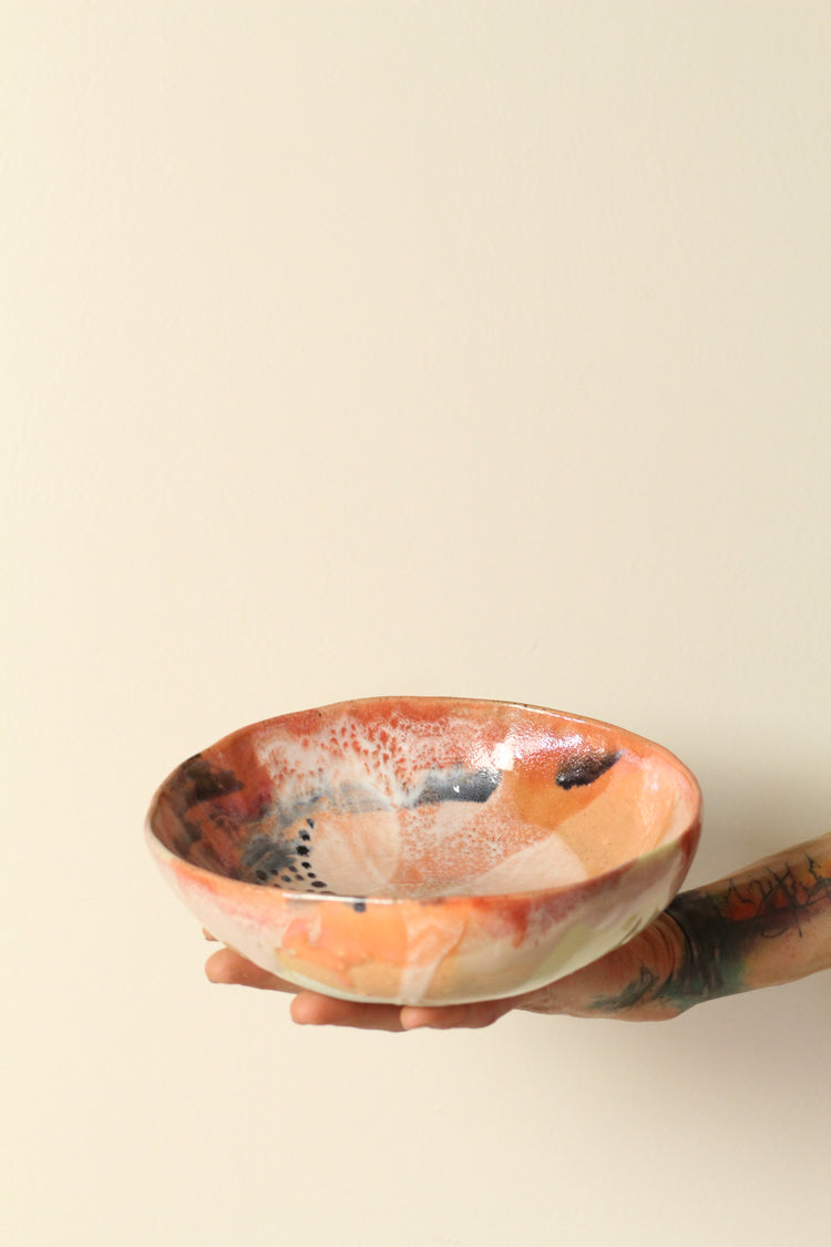 Peach, pink, orange and yellow with black dots everything bowl