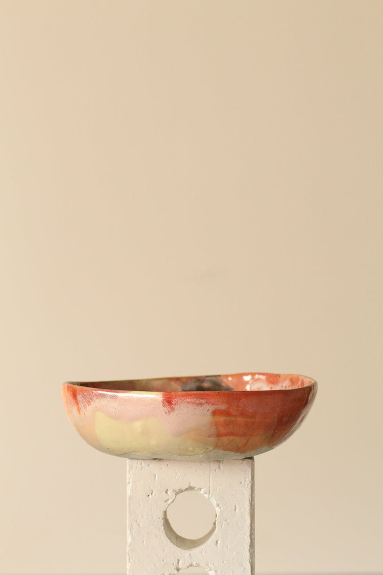 Peach, pink, orange and yellow with black dots everything bowl