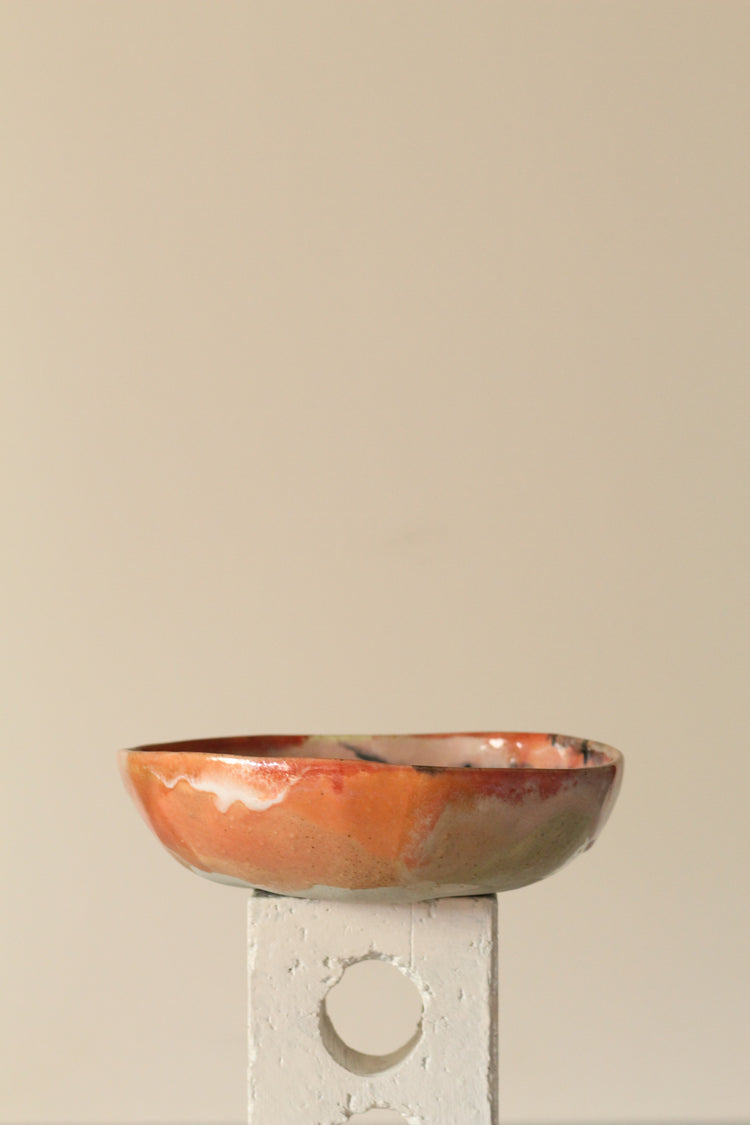 Peach, pink, orange and yellow with black dots everything bowl