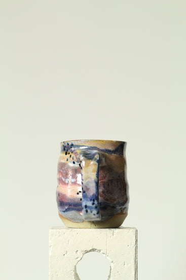 Handmade ceramic mug in the Body form with Imprint handle detail, finished in painterly Dusk glaze with layered blues, violet and warm clay tones.