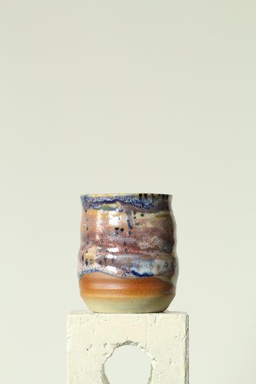 Handmade ceramic mug in the Body form with Imprint handle detail, finished in painterly Dusk glaze with layered blues, violet and warm clay tones.