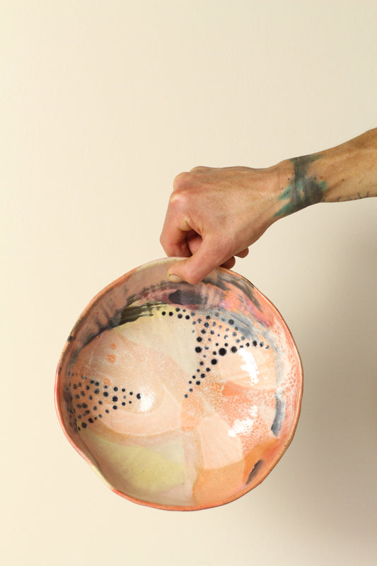 Peach, pink, orange and yellow with black dots everything bowl
