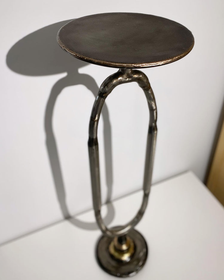 Circular steel display table